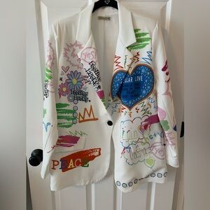 white blazer with colorful, graffiti-style designs,